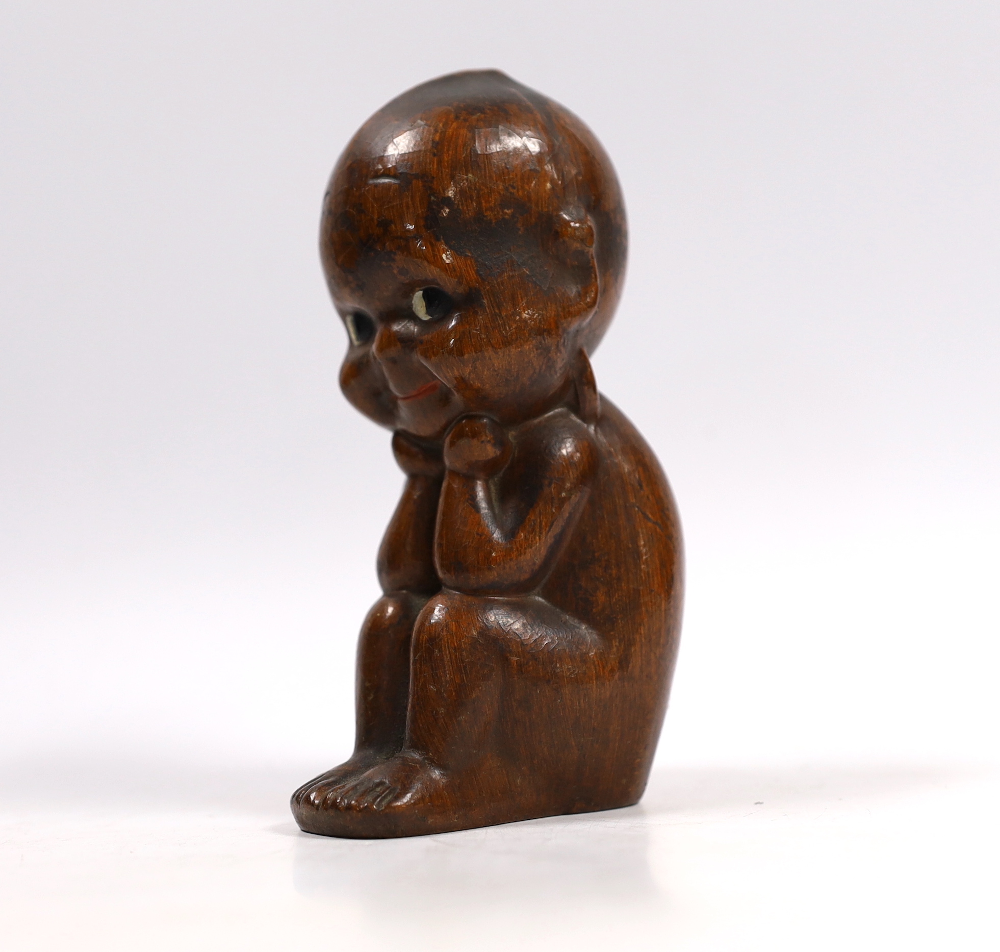 A Kewpie composition figure with painted eyes, 14cm high